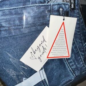 PrettyLittleThing USA wide legged Blue Jeans with strips